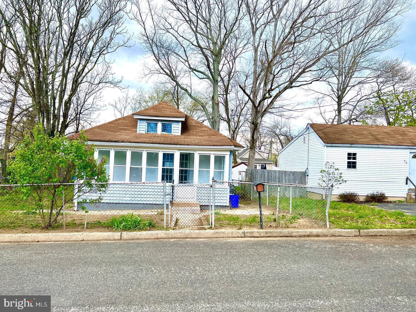27 Rancocas Avenue Clementon, NJ 08021 - Photo 14 of 16 a front view of a house with a yard and garage