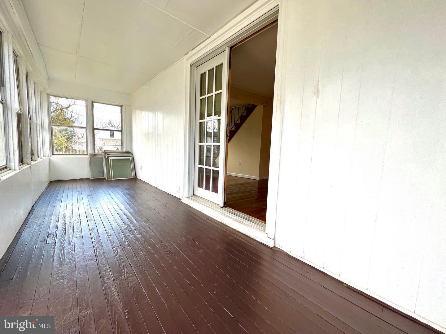 27 Rancocas Avenue Clementon, NJ 08021 - Photo 2 of 16 an empty room with wooden floor and windows