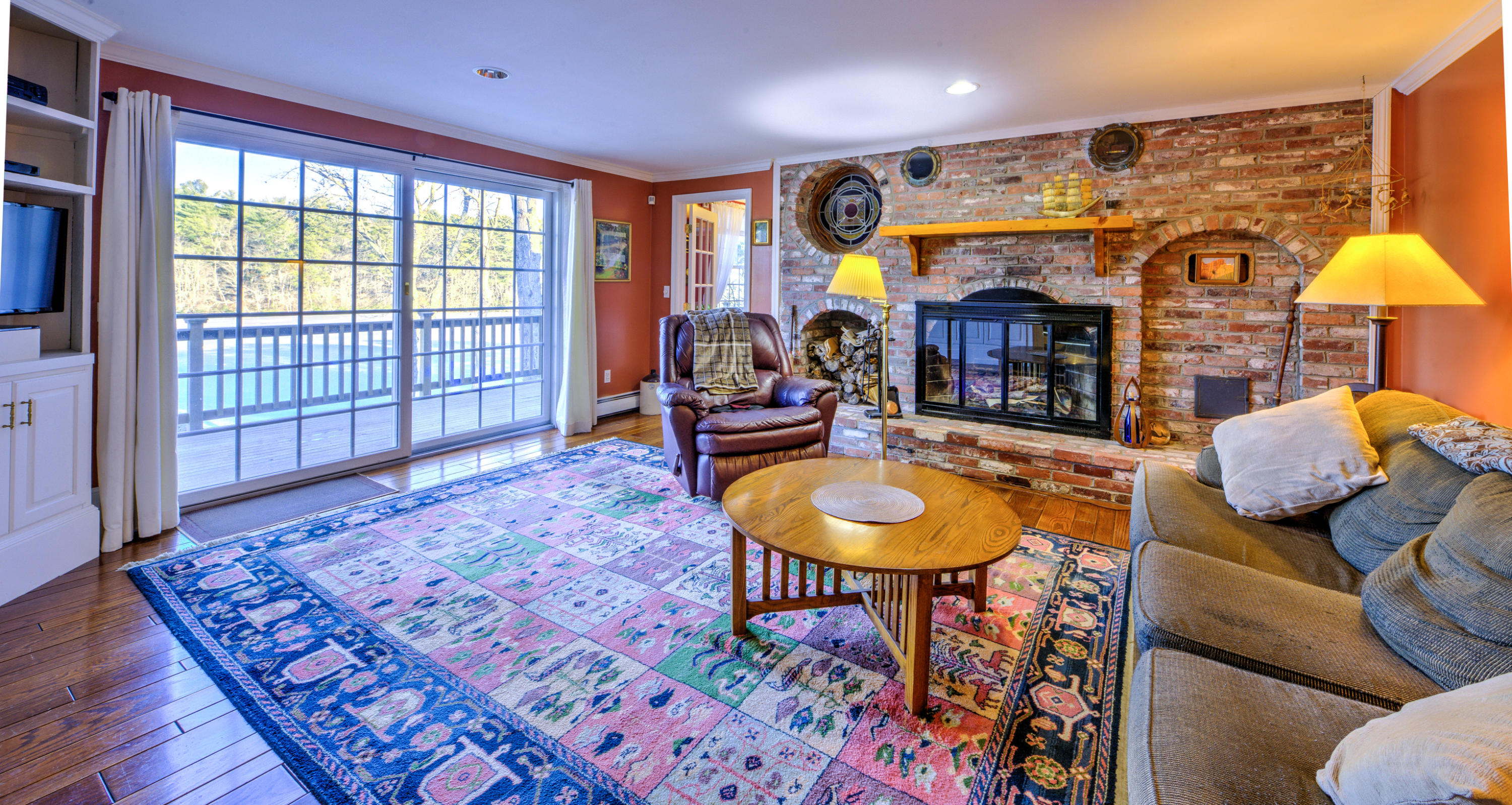 558 Lumbert Mill Road Centerville, MA 02632 - Photo 11 of 33 FR fireplace and sliders to deck