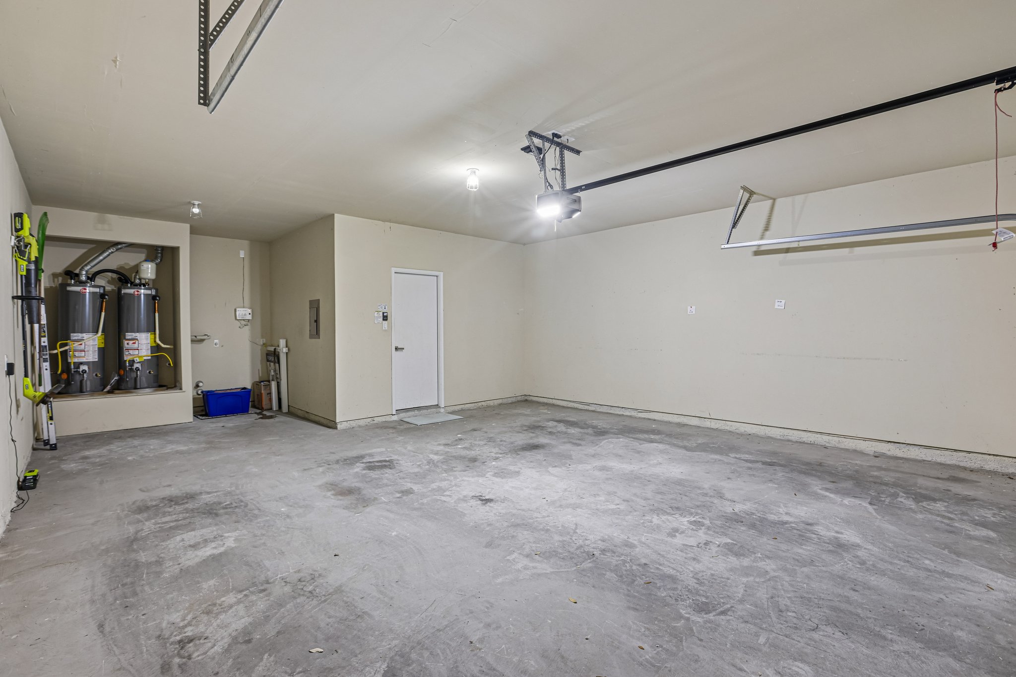 1924 Granite Springs Road Leander, TX 78641 - Photo 32 of 36 A spacious, oversized clean garage provides ample storage and utility access, ready for vehicles or projects.