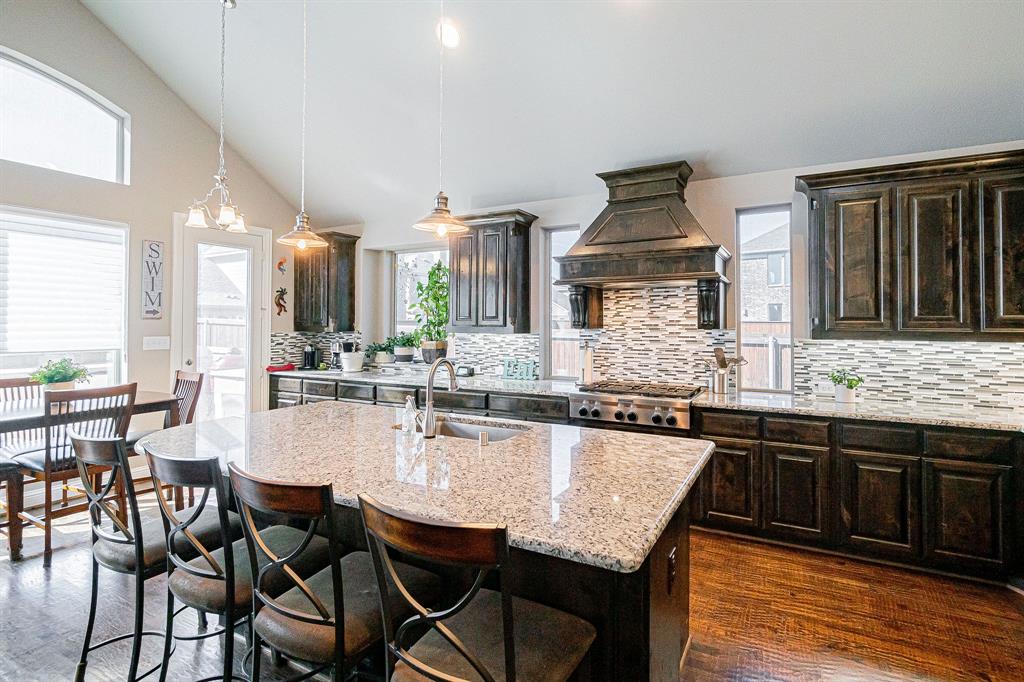 a kitchen with granite countertop lots of counter top space and dining table
