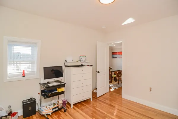 a workspace with furniture and wooden floor