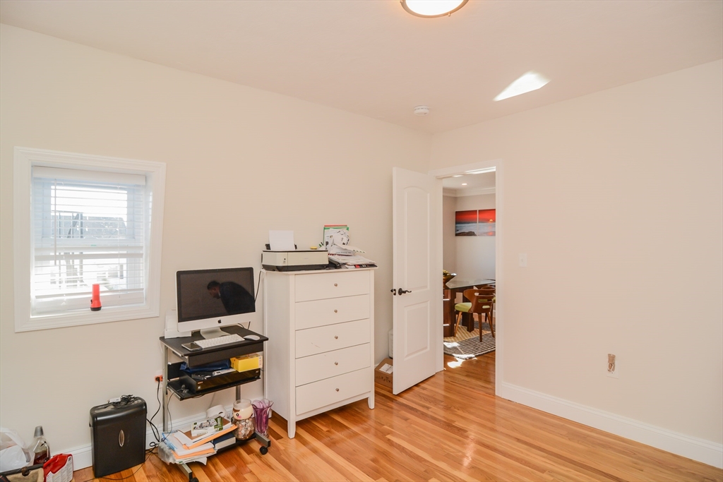 56-58 Orvis, Unit 2 Revere, MA 02151 - Photo 7 of 12 a workspace with furniture and wooden floor