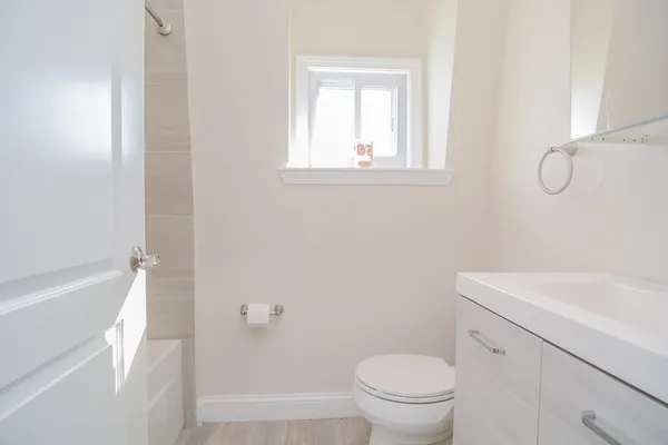 a bathroom with a sink a toilet and a bathtub