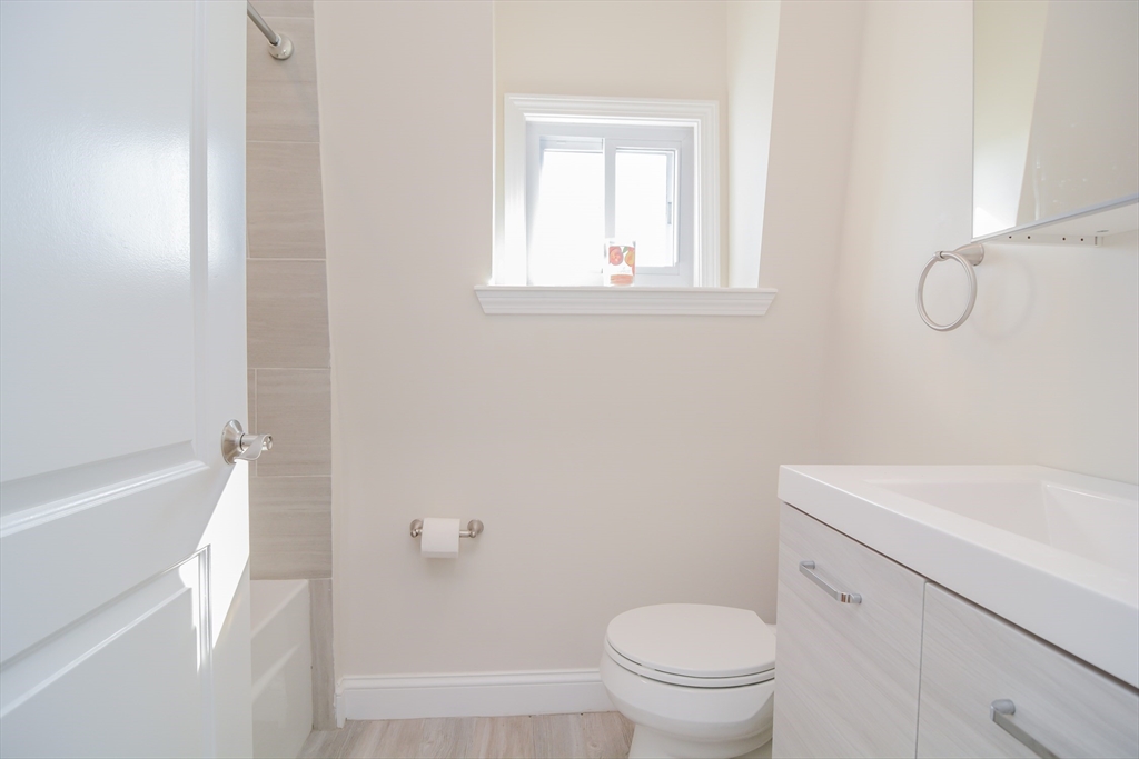 56-58 Orvis, Unit 2 Revere, MA 02151 - Photo 8 of 12 a bathroom with a sink a toilet and a bathtub