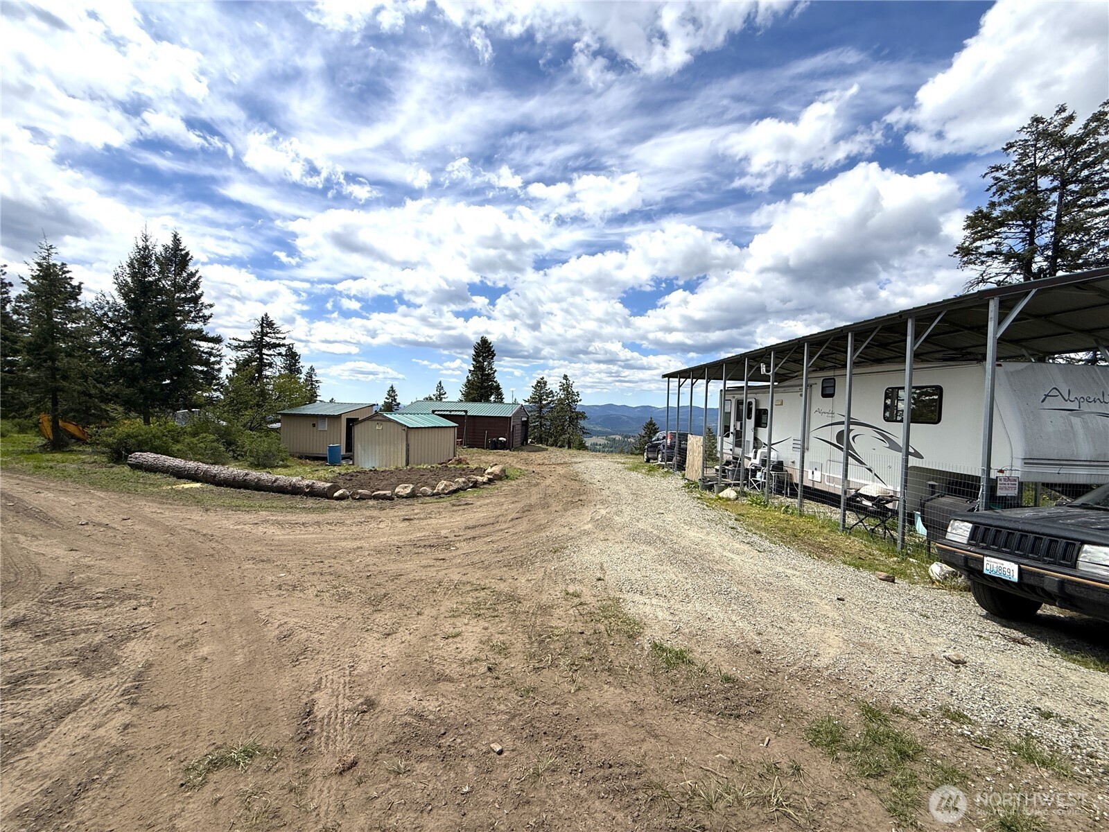 19 Union Ridge Spur Road Republic, WA 99166 - Photo 4 of 33 a view of a house with backyard and sitting area
