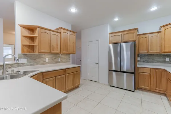 a front view of a house with wooden fence