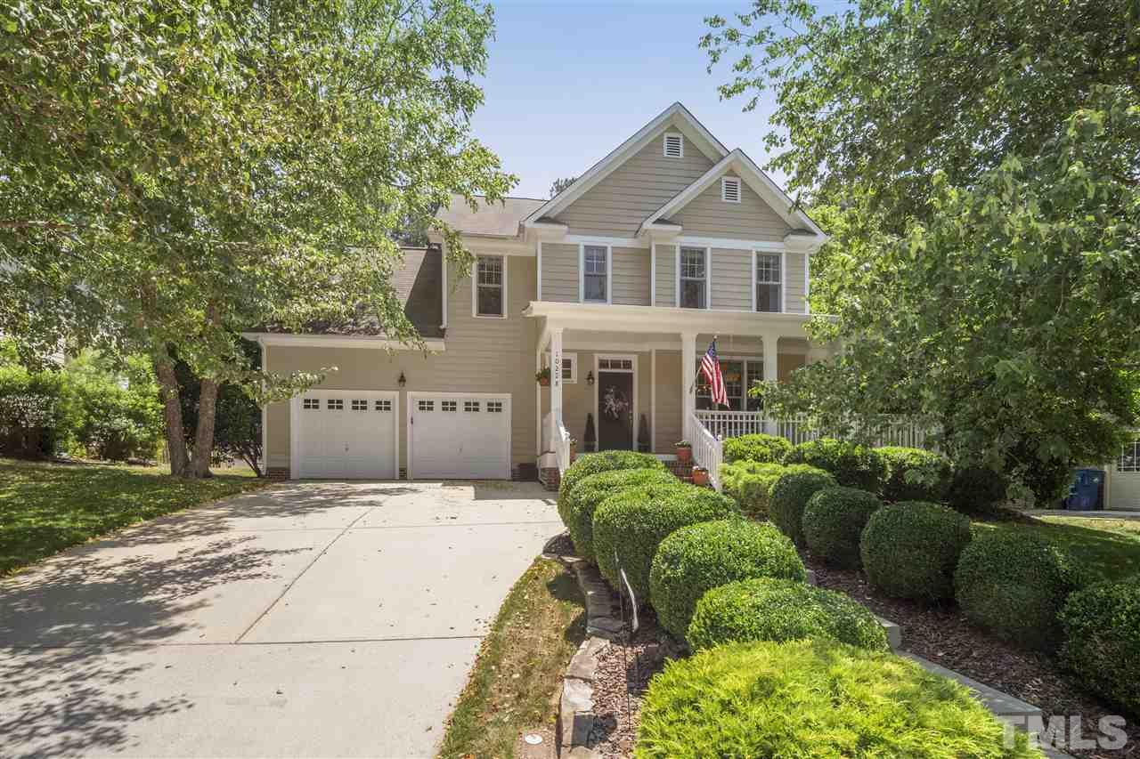 10228 River Bank Drive Raleigh, NC 27614 - Photo 1 of 29 a front view of a house with a garden