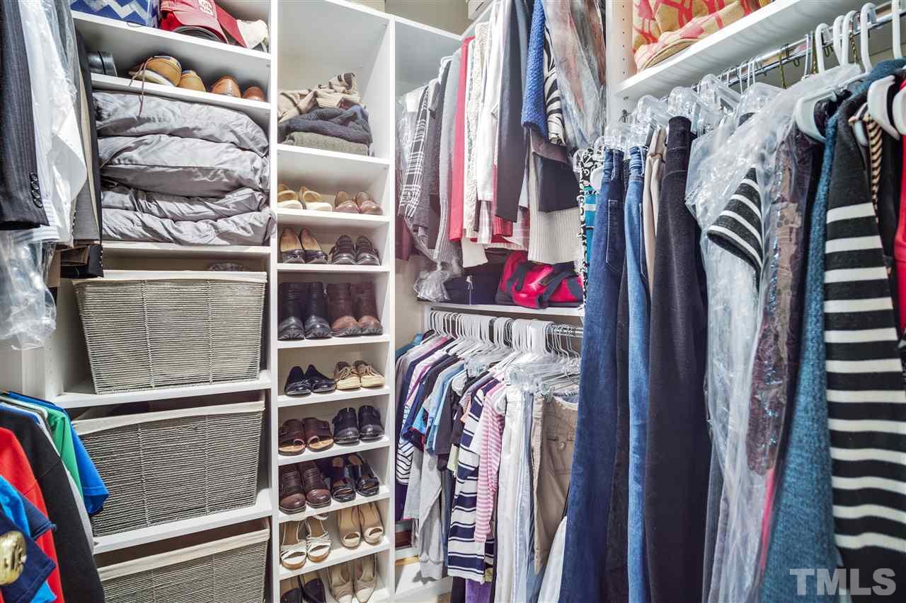 10228 River Bank Drive Raleigh, NC 27614 - Photo 14 of 29 a view of walk in closet with clothes and shoes
