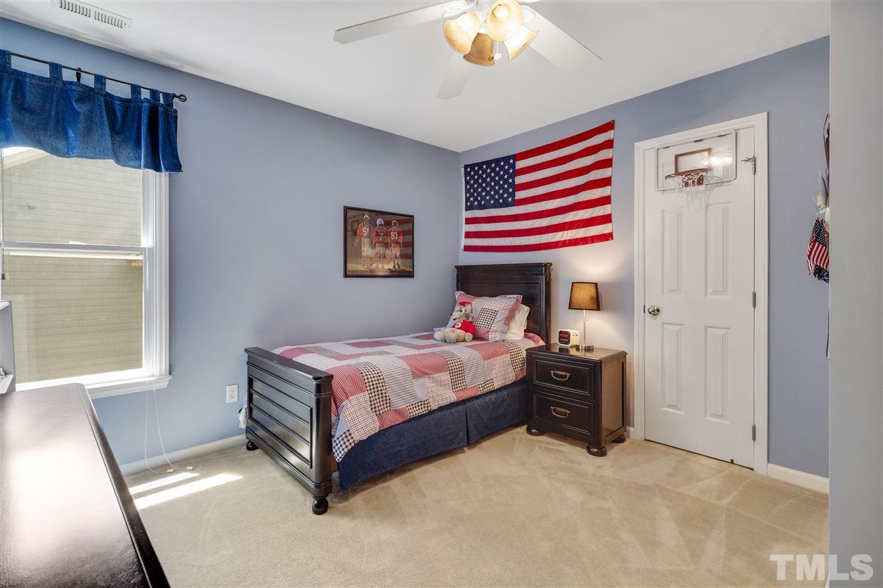 10228 River Bank Drive Raleigh, NC 27614 - Photo 15 of 29 a bedroom with a bed and a window