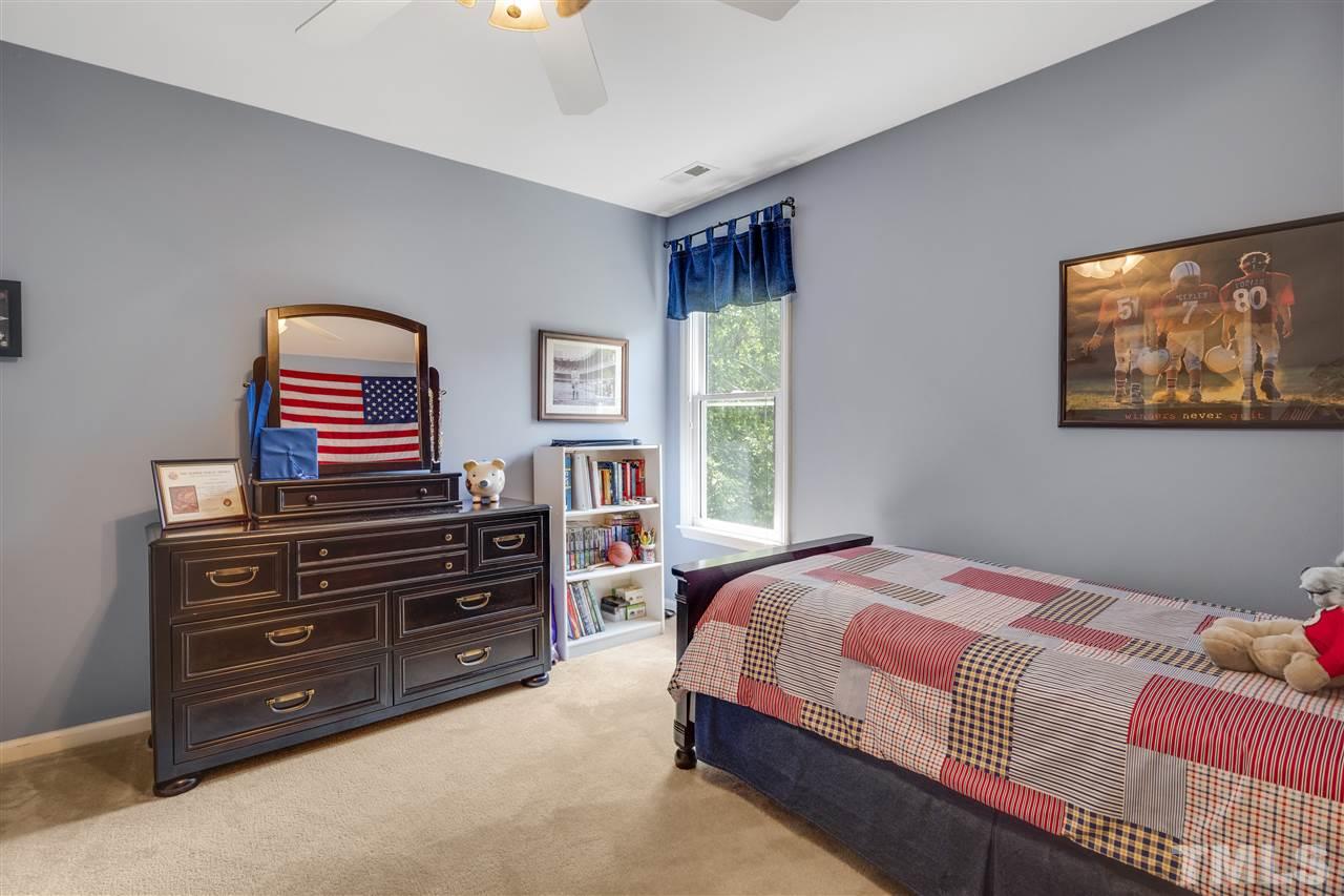 10228 River Bank Drive Raleigh, NC 27614 - Photo 16 of 29 a bedroom with a bed and a television
