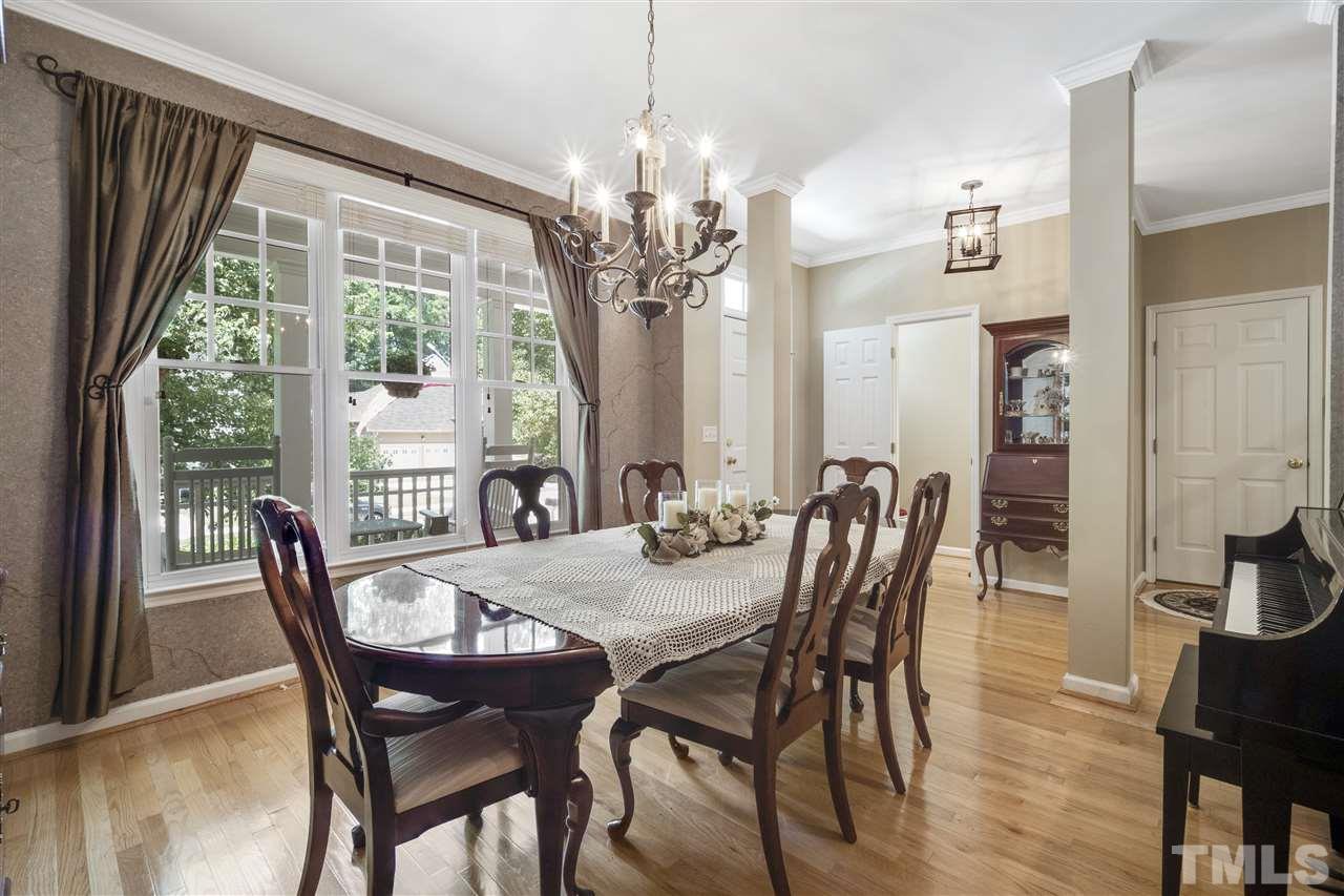 10228 River Bank Drive Raleigh, NC 27614 - Photo 3 of 29 a view of a dining room with furniture window and outside view