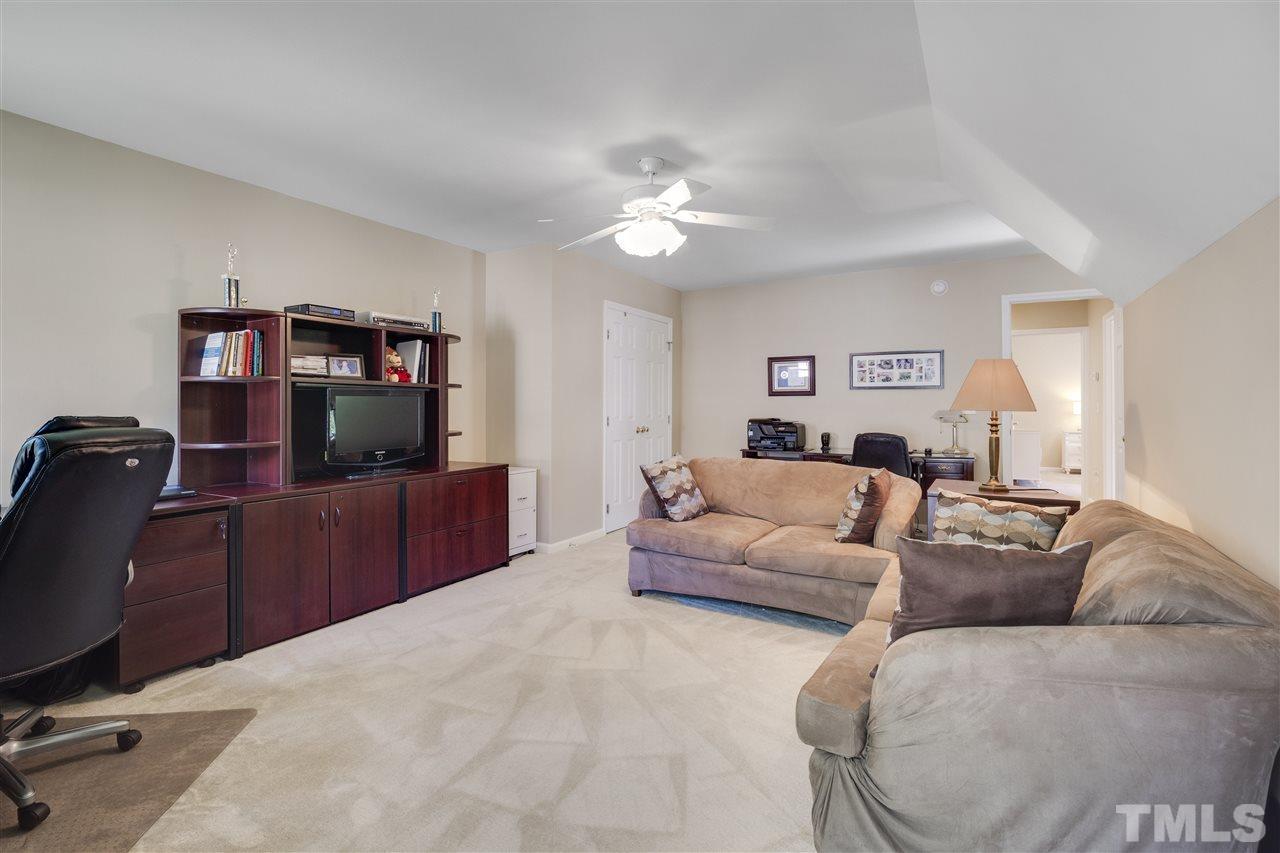 10228 River Bank Drive Raleigh, NC 27614 - Photo 21 of 29 a living room with furniture and a flat screen tv