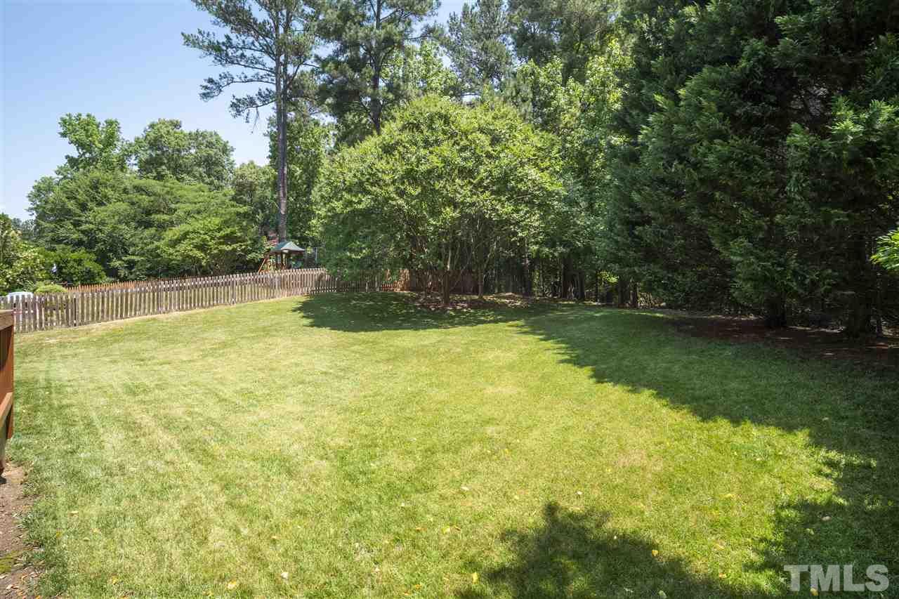 10228 River Bank Drive Raleigh, NC 27614 - Photo 27 of 29 a view of a swimming pool with a yard