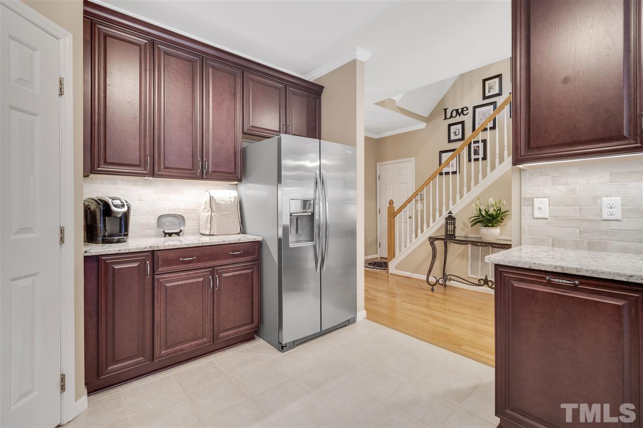 10228 River Bank Drive Raleigh, NC 27614 - Photo 5 of 29 a kitchen with stainless steel appliances granite countertop a refrigerator and a sink
