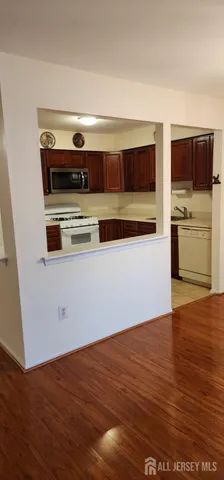 a view of kitchen with wooden floor