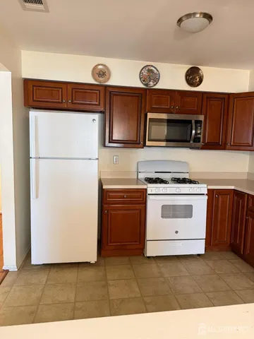 a kitchen with a stove and a microwave