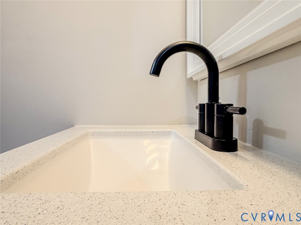3409 Meadowbridge Road Richmond, VA 23222 - Photo 18 of 32 a close view of a faucet a sink and a tap
