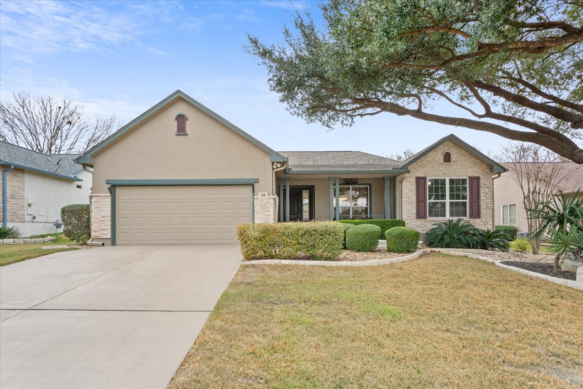 246 Red Poppy Trail Georgetown, TX 78633 - Photo 3 of 32 a front view of a house with a yard and garage