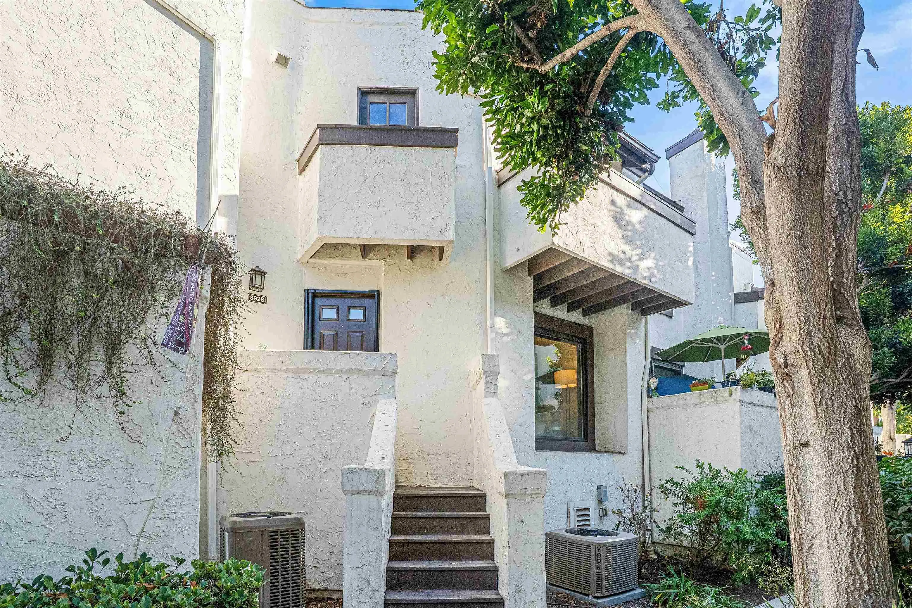 3926 Voltaire Street San Diego, CA 92107 - Photo 2 of 30 a view of a house with a tree