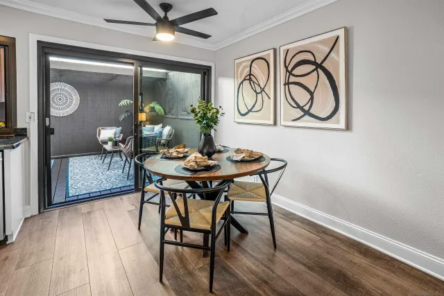 a view of a dining room with furniture and wooden floor