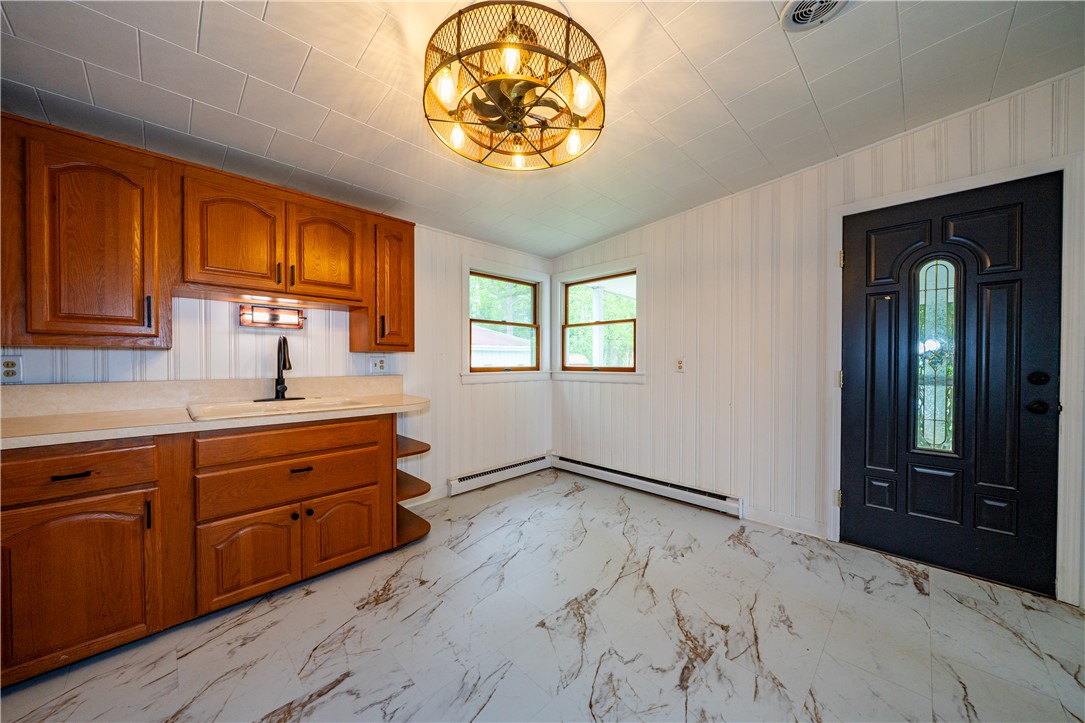 11296 Pansing Road Brookville, OH 45309 - Photo 13 of 53 This bright kitchen features ample cabinet space and convenient access to the???????????????????????? outdoors.