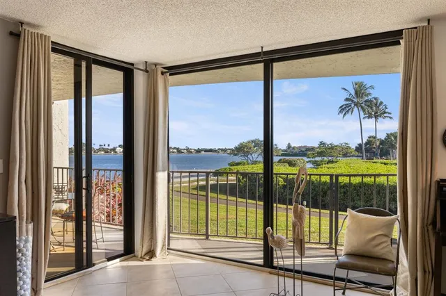 a view of a glass door with a floor to ceiling window