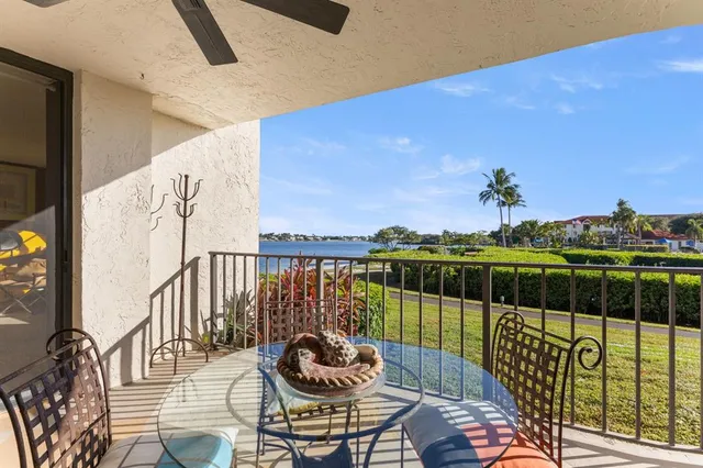 a view of a balcony with furniture