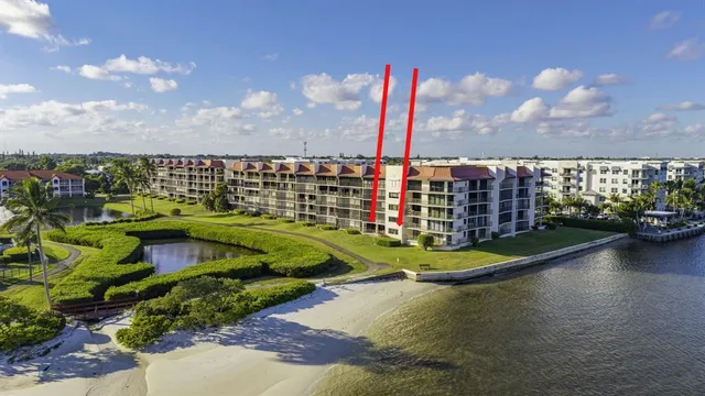 a view of a garden with tall buildings
