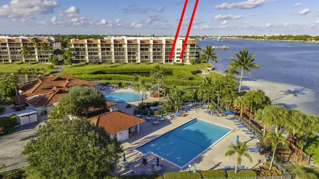 an aerial view of a house with a garden and plants