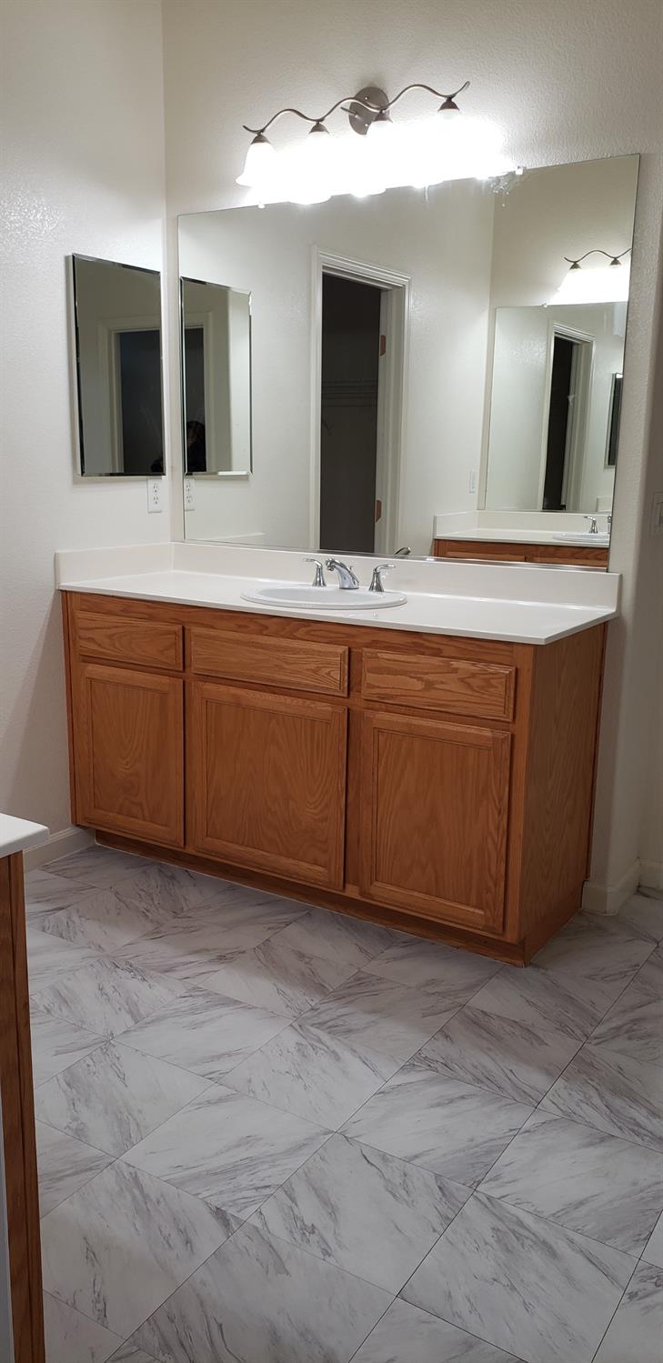 10726 Irene Way Live Oak, CA 95953 - Photo 13 of 50 a bathroom with a sink and mirror