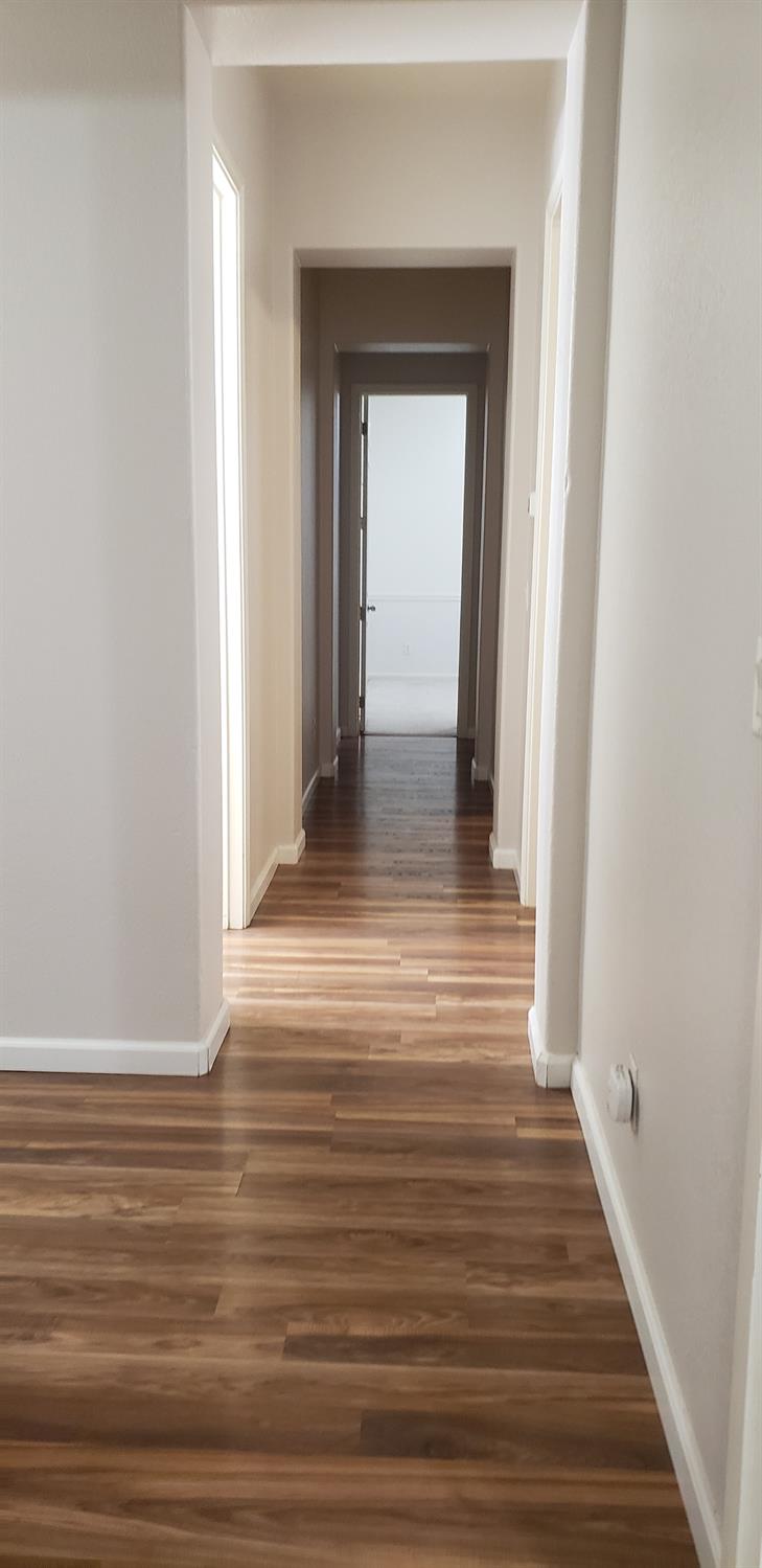 10726 Irene Way Live Oak, CA 95953 - Photo 16 of 50 a view of a hallway view with wooden floor and staircase