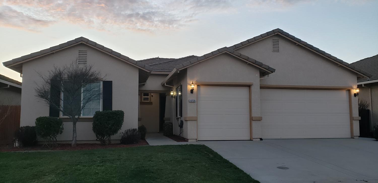 10726 Irene Way Live Oak, CA 95953 - Photo 2 of 50 a front view of a house with garden