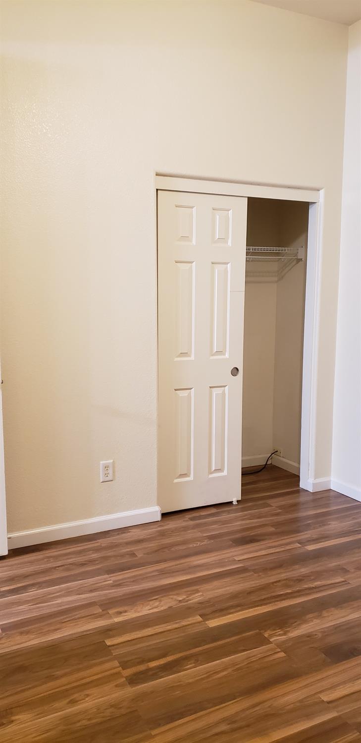10726 Irene Way Live Oak, CA 95953 - Photo 23 of 50 a view of empty room with wooden floor