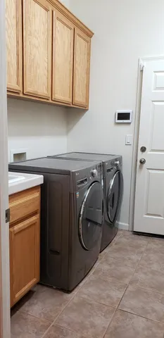 a view of an empty room with a cabinet