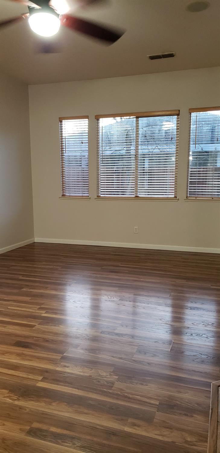 10726 Irene Way Live Oak, CA 95953 - Photo 47 of 50 a view of room with window and wooden floor