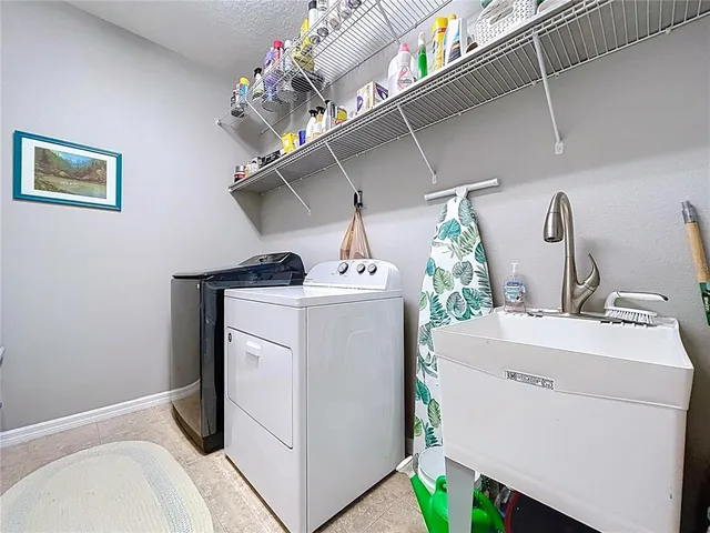 a utility room with dryer and washer