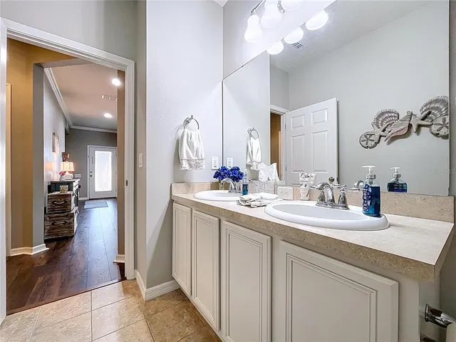 a bathroom with a sink a vanity and a mirror