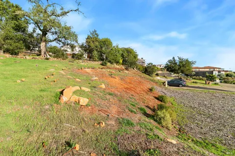 a view of a street with a yard