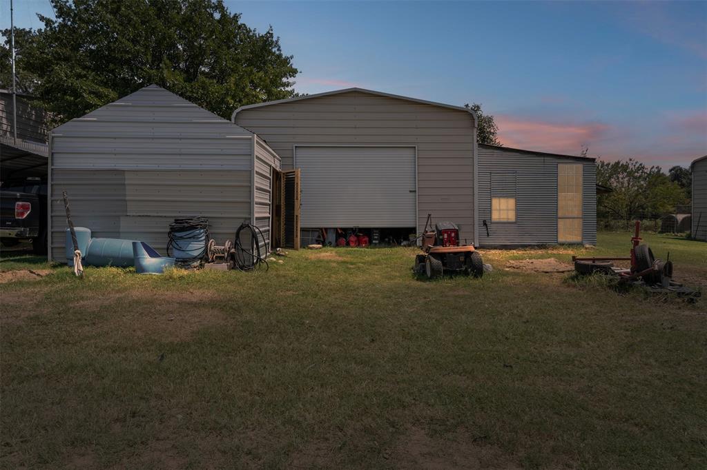 3100 Sarra Lane Springtown, TX 76082 - Photo 13 of 40 a backyard of house with table and chairs