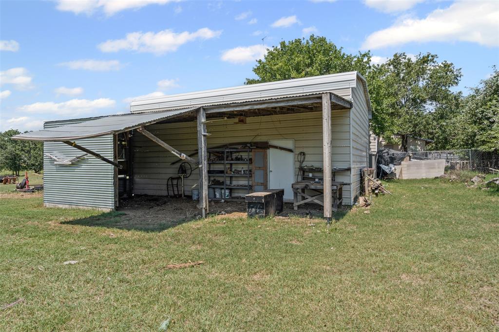 3100 Sarra Lane Springtown, TX 76082 - Photo 18 of 40 a view of a house with a backyard