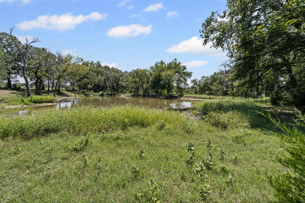 3100 Sarra Lane Springtown, TX 76082 - Photo 25 of 40 a view of a lake with houses in the back