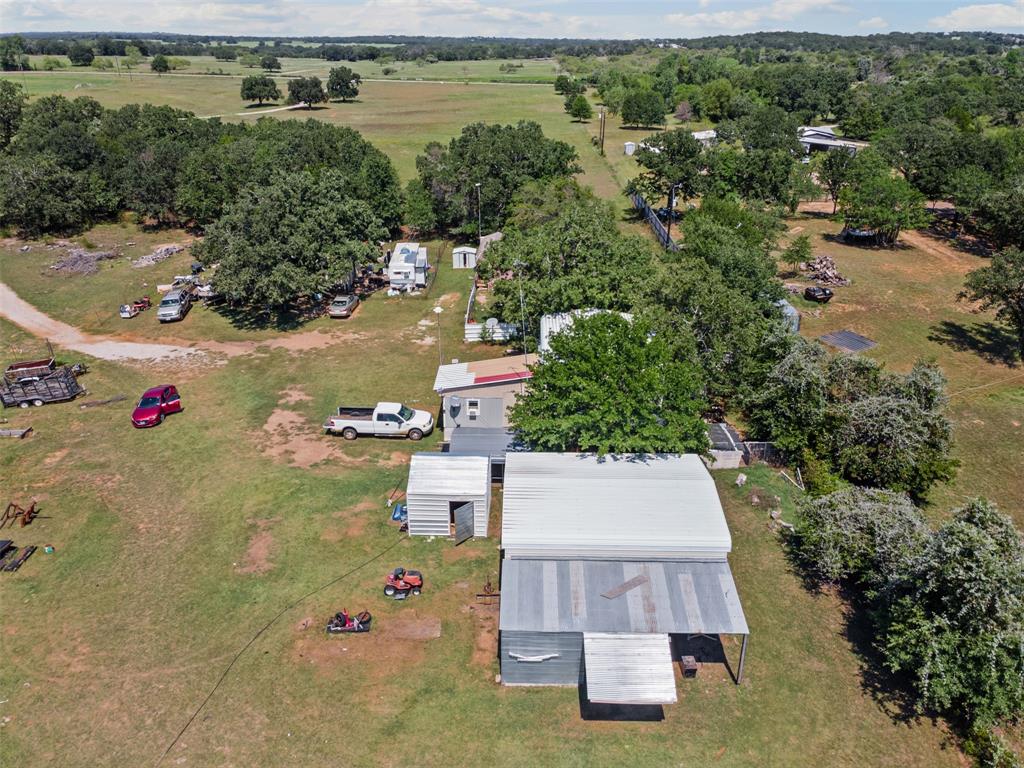 3100 Sarra Lane Springtown, TX 76082 - Photo 37 of 40 an aerial view of a house with outdoor space swimming pool and lake view
