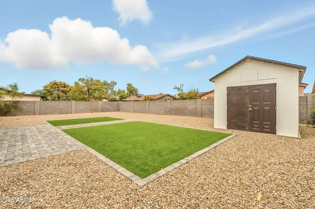 a view of a backyard with green space