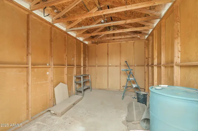 a view of a room with wooden floor and windows