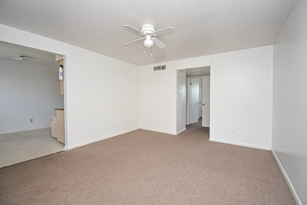 20 South Mechanic Street Bellville, TX 77418 - Photo 5 of 8 a view of an empty room with a ceiling fan