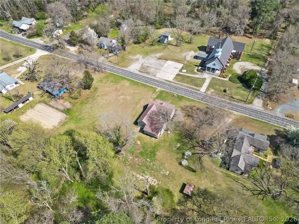 a view of swimming pool with a yard and seating space