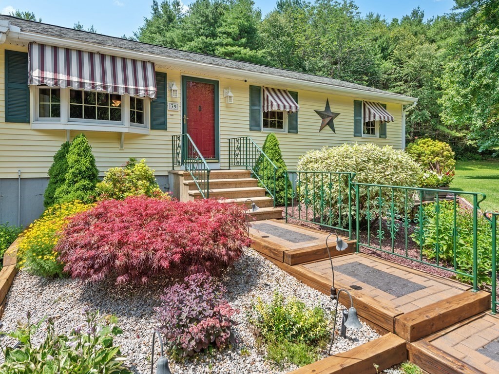 39 Fitzgerald Road Charlton, MA 01507 - Photo 31 of 37 a front view of a house with garden