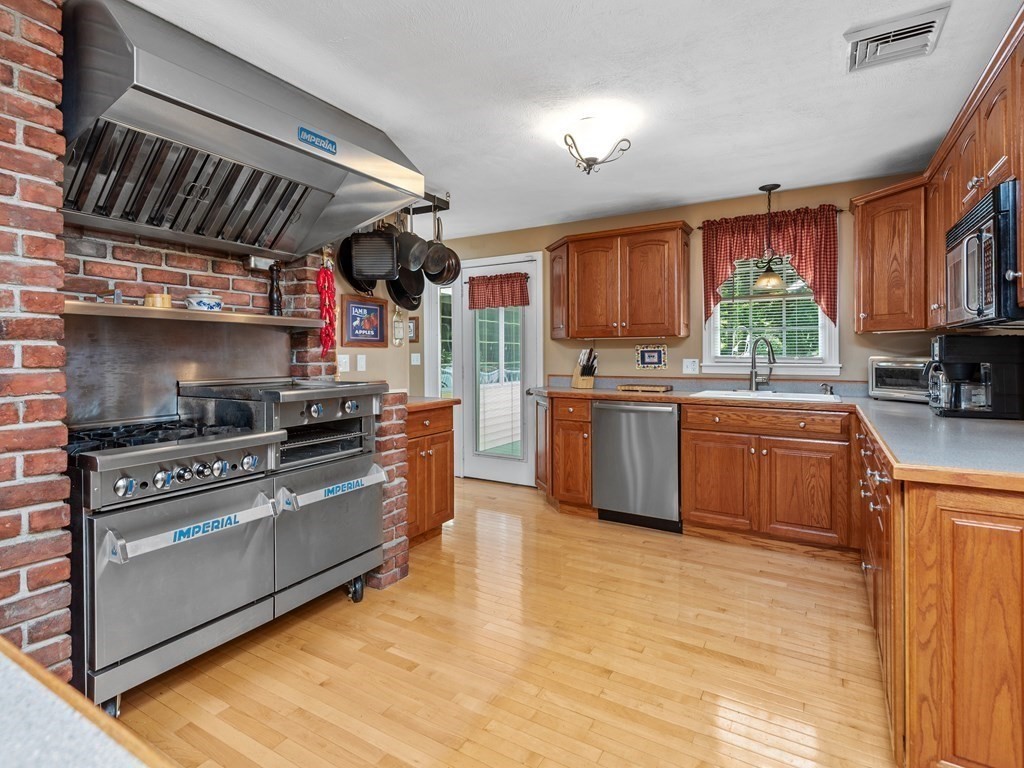 39 Fitzgerald Road Charlton, MA 01507 - Photo 8 of 37 a kitchen with stainless steel appliances granite countertop a stove a sink dishwasher and a refrigerator