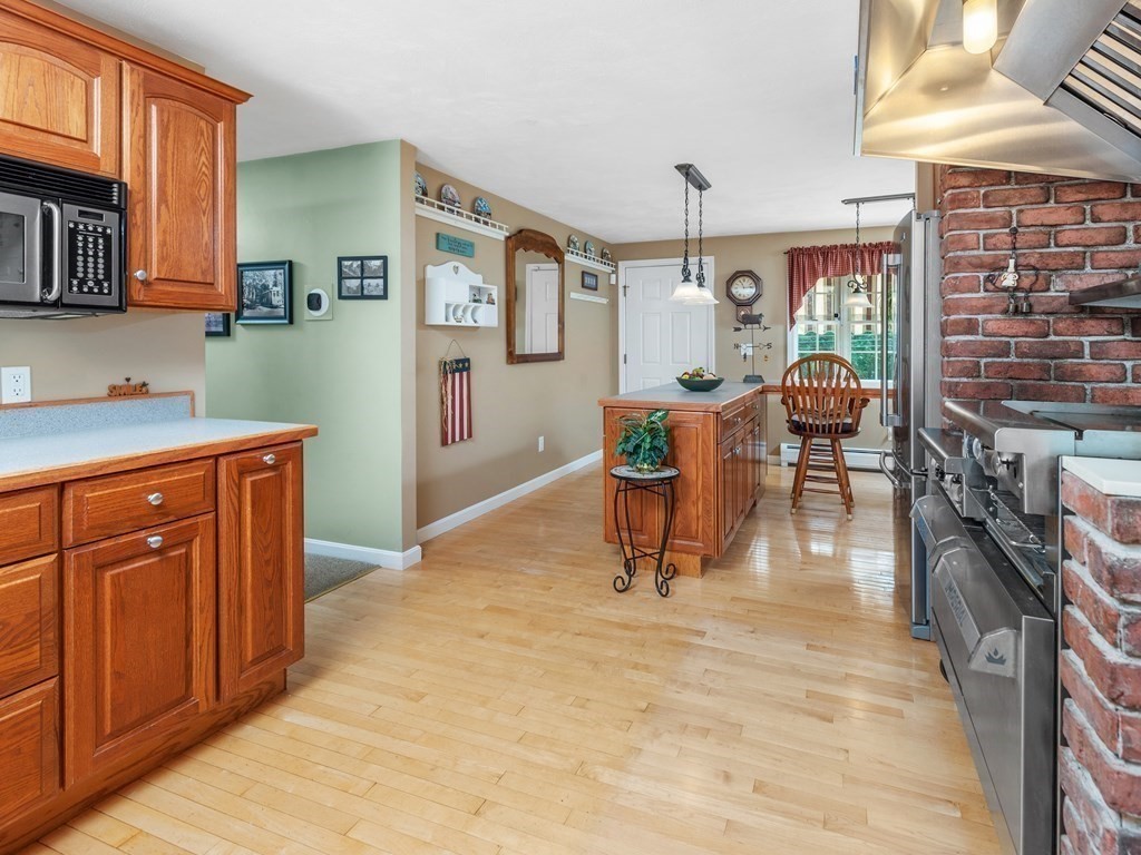 39 Fitzgerald Road Charlton, MA 01507 - Photo 9 of 37 a living room with furniture a flat screen tv and a dining table
